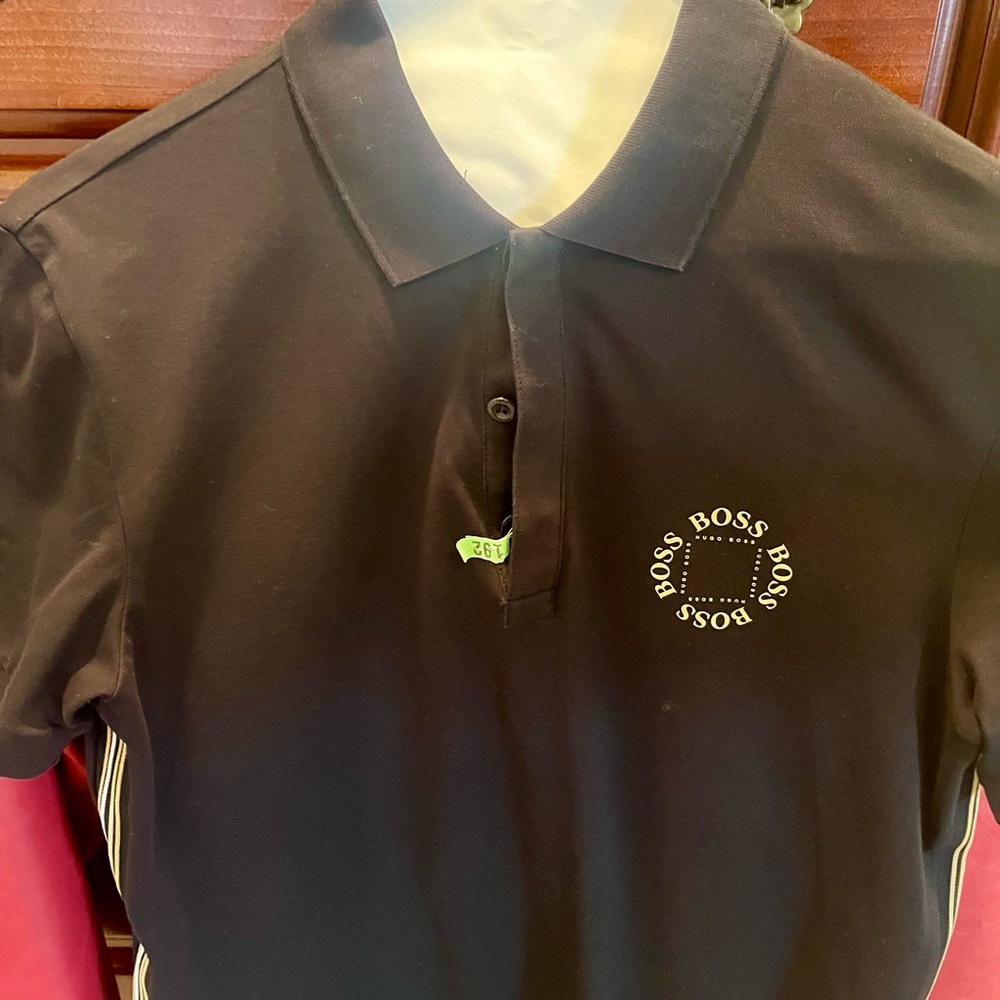 Boss Polo Size Small. Great fit and style for any man on the go. Beautiful!